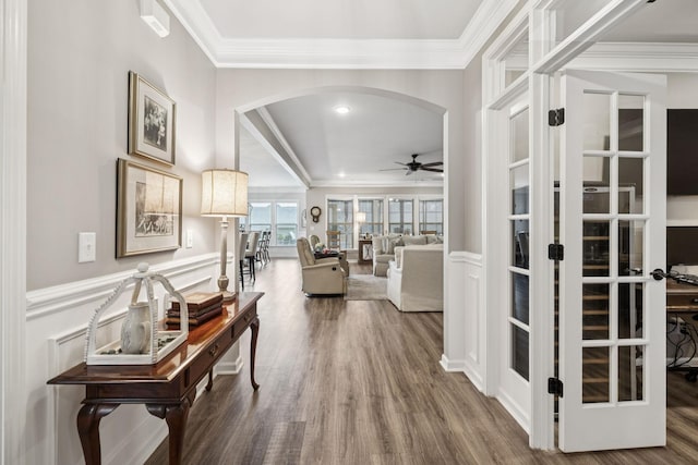 679 Overton Way, Spring Hill, TN 37174 - hallway with arched walkways, ornamental molding, wood finished floors, wainscoting, and french doors