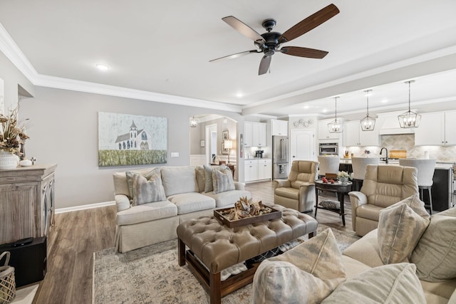 679 Overton Way, Spring Hill, TN 37174 - living area featuring ceiling fan, arched walkways, light wood-type flooring, crown molding, and recessed lighting