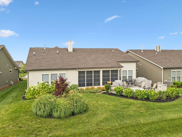 679 Overton Way, Spring Hill, TN 37174 - rear view of property with a patio area, a yard, a chimney, and roof with shingles