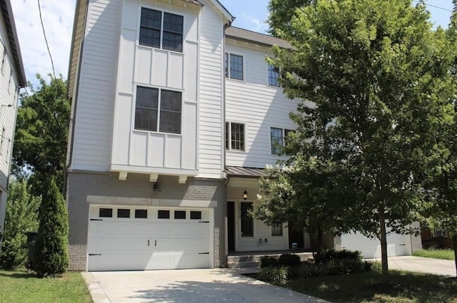 1512 Kirkwood Ave, Nashville, TN 37212 - view of front of home featuring board and batten siding, driveway, and an attached garage