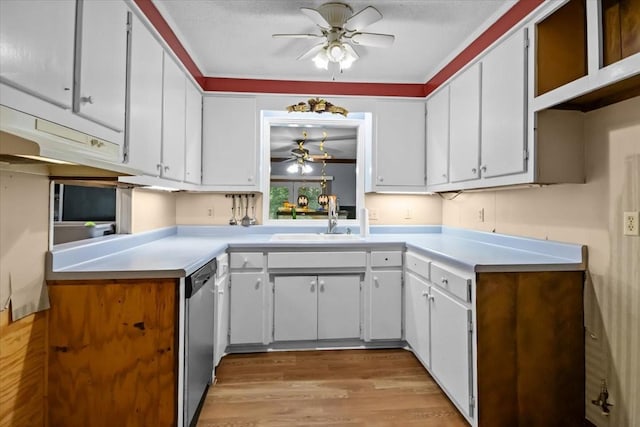 106 Ulcer Hollow Rd, Waverly, TN 37185 - kitchen featuring a ceiling fan, dishwasher, light countertops, light wood-style floors, and white cabinetry