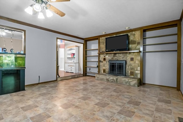 106 Ulcer Hollow Rd, Waverly, TN 37185 - unfurnished living room featuring built in shelves, a ceiling fan, a stone fireplace, crown molding, and stone finish flooring