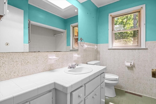 106 Ulcer Hollow Rd, Waverly, TN 37185 - full bath featuring vanity, wainscoting, tile walls, tile patterned floors, and a shower