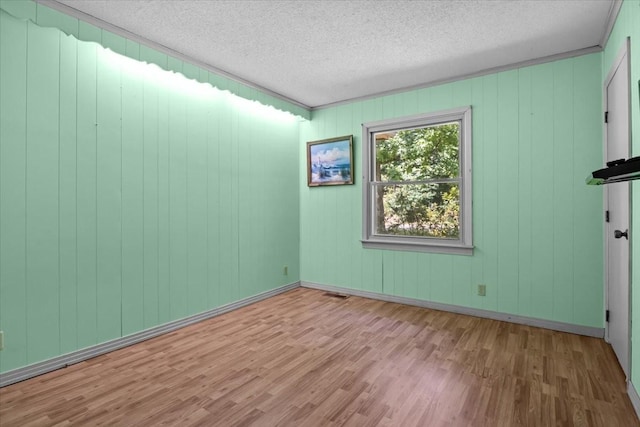 106 Ulcer Hollow Rd, Waverly, TN 37185 - empty room featuring wood finished floors and a textured ceiling