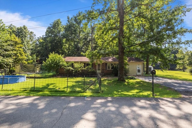 106 Ulcer Hollow Rd, Waverly, TN 37185 - single story home with a trampoline and driveway