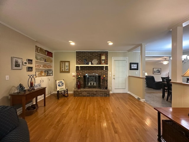 412 Winwood Dr, Lebanon, TN 37087 - living room with ornamental molding, a fireplace, wood finished floors, ceiling fan, and recessed lighting