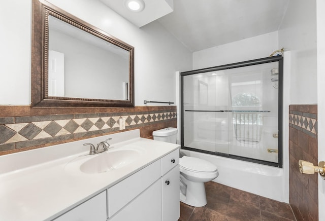 3899 Sadlersville Rd, Adams, TN 37010 - bathroom with tile walls, vanity, enclosed tub / shower combo, and a wainscoted wall