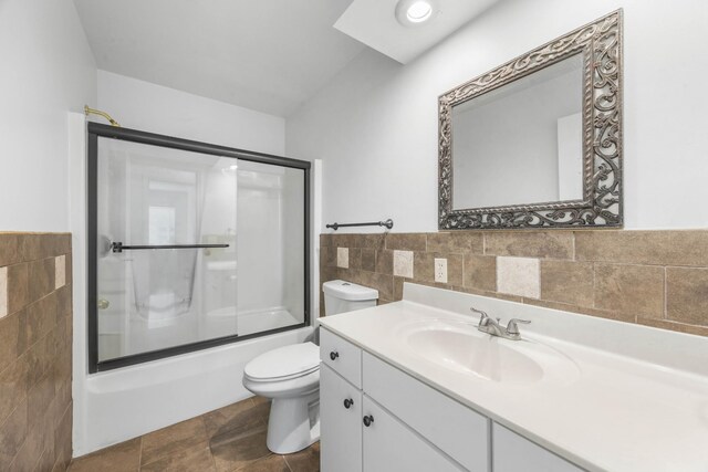 3899 Sadlersville Rd, Adams, TN 37010 - full bathroom featuring tile walls, vanity, enclosed tub / shower combo, and wainscoting