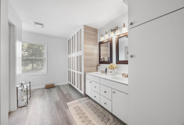 3899 Sadlersville Rd, Adams, TN 37010 - full bathroom featuring double vanity and wood finished floors