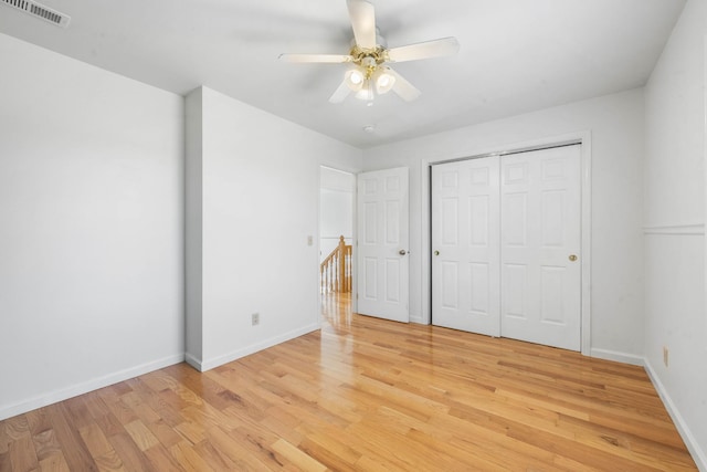 3899 Sadlersville Rd, Adams, TN 37010 - unfurnished bedroom featuring light wood-style flooring, a closet, and a ceiling fan