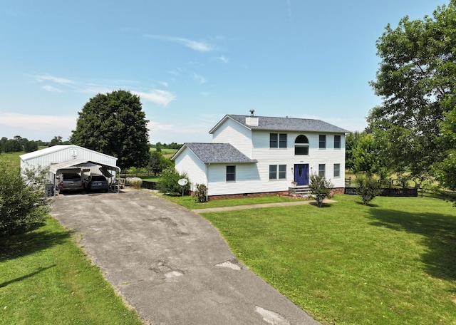 3899 Sadlersville Rd, Adams, TN 37010 - colonial inspired home with a front yard, driveway, a detached carport, and a shingled roof