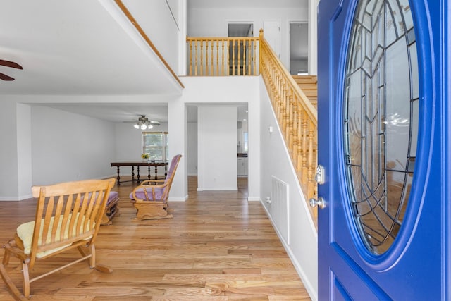 3899 Sadlersville Rd, Adams, TN 37010 - foyer entrance featuring a ceiling fan, wood finished floors, and stairway