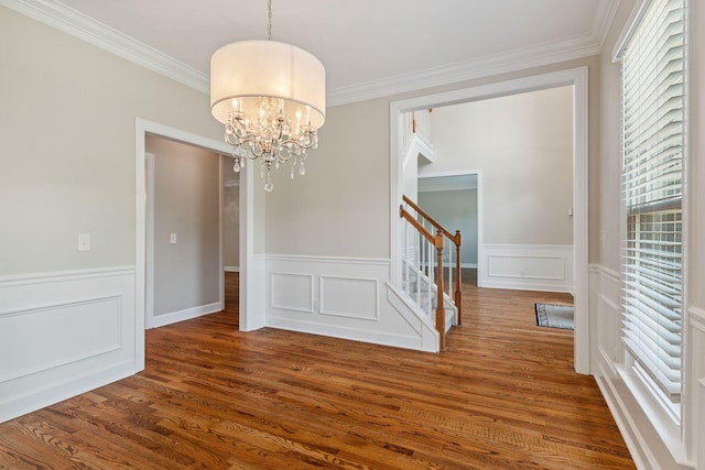 2105 Chels Way, Old Hickory, TN 37138 - unfurnished dining area featuring a chandelier, healthy amount of natural light, stairs, crown molding, and a wainscoted wall