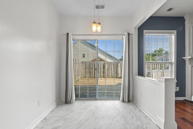 3405 Old Anderson Rd Unit 203, Antioch, TN 37013 - unfurnished dining area with healthy amount of natural light, a chandelier, and marble finish floors