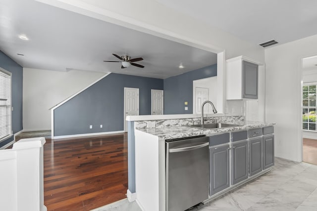 3405 Old Anderson Rd Unit 203, Antioch, TN 37013 - kitchen featuring dishwasher, ceiling fan, gray cabinets, light stone counters, and open floor plan