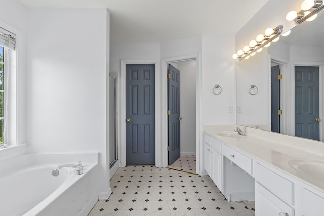 3405 Old Anderson Rd Unit 203, Antioch, TN 37013 - full bathroom featuring tile patterned floors, double vanity, a garden tub, and a shower stall