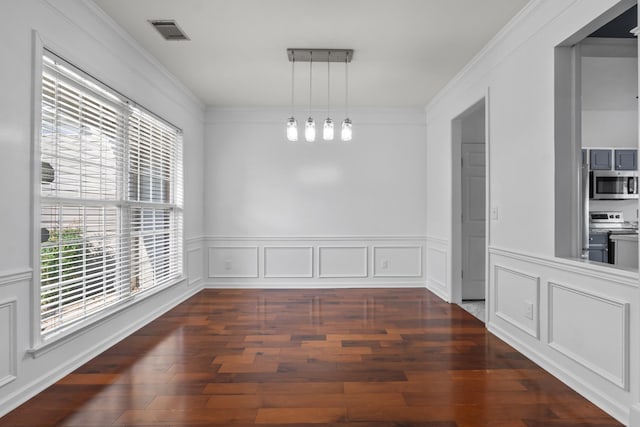 3405 Old Anderson Rd Unit 203, Antioch, TN 37013 - unfurnished dining area featuring dark wood-style floors, crown molding, and wainscoting