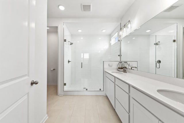 2337 Williamsport Lndg, Columbia, TN 38401 - bathroom with a stall shower, double vanity, tile patterned flooring, and recessed lighting