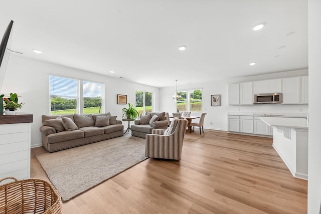 2337 Williamsport Lndg, Columbia, TN 38401 - living area with light wood-style flooring, recessed lighting, and a chandelier