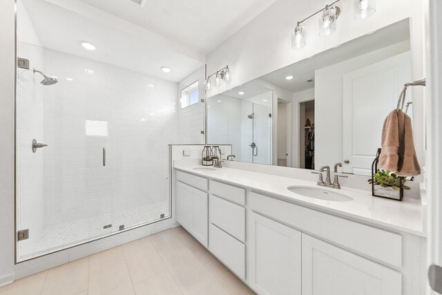 2337 Williamsport Lndg, Columbia, TN 38401 - full bath featuring a shower stall, double vanity, tile patterned flooring, a spacious closet, and recessed lighting