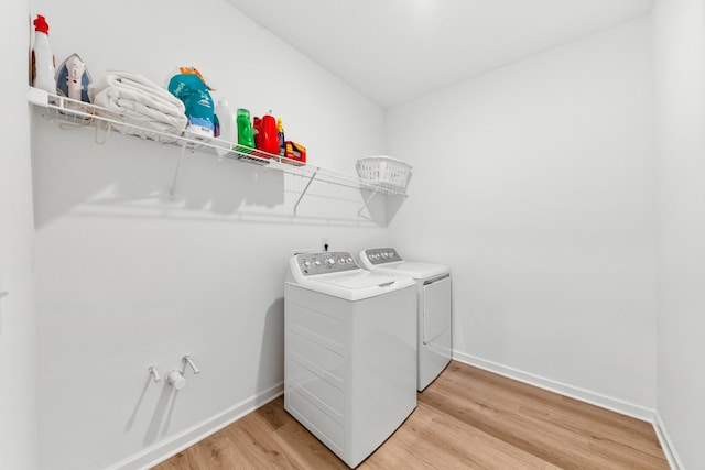 2337 Williamsport Lndg, Columbia, TN 38401 - laundry room with light wood-style floors and washing machine and clothes dryer