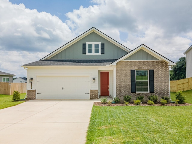 2337 Williamsport Lndg, Columbia, TN 38401 - craftsman-style house with board and batten siding, brick siding, driveway, and a shingled roof