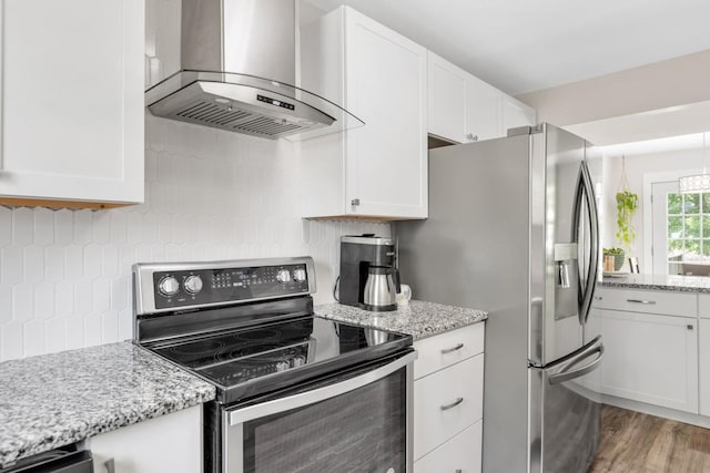 117 Maple Way N, Hendersonville, TN 37075 - kitchen featuring stainless steel appliances, extractor fan, white cabinetry, and tasteful backsplash