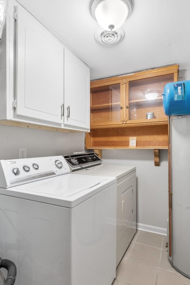 117 Maple Way N, Hendersonville, TN 37075 - laundry room featuring washing machine and dryer, cabinet space, and light tile patterned floors