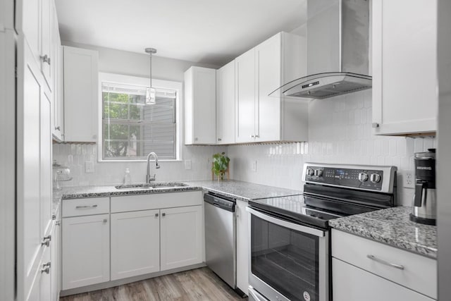 117 Maple Way N, Hendersonville, TN 37075 - kitchen with appliances with stainless steel finishes, wall chimney exhaust hood, white cabinetry, and light wood finished floors