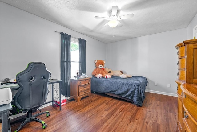 705 Pineridge Dr, Hopkinsville, KY 42240 - bedroom with wood finished floors, ceiling fan, a textured ceiling, and a desk