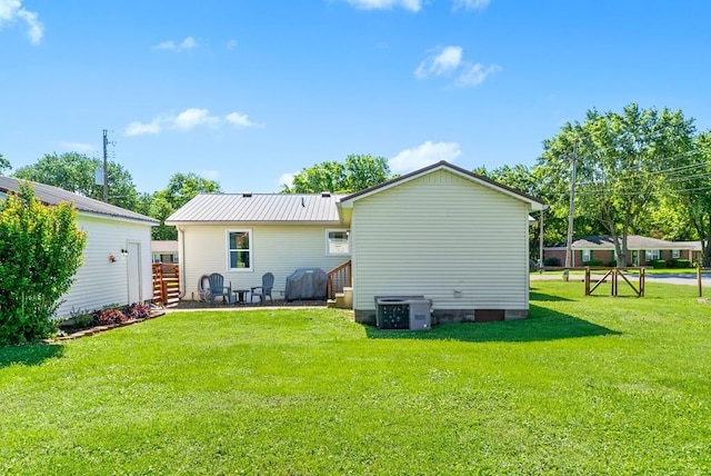 705 Pineridge Dr, Hopkinsville, KY 42240 - rear view of house with a lawn, a metal roof, and entry steps