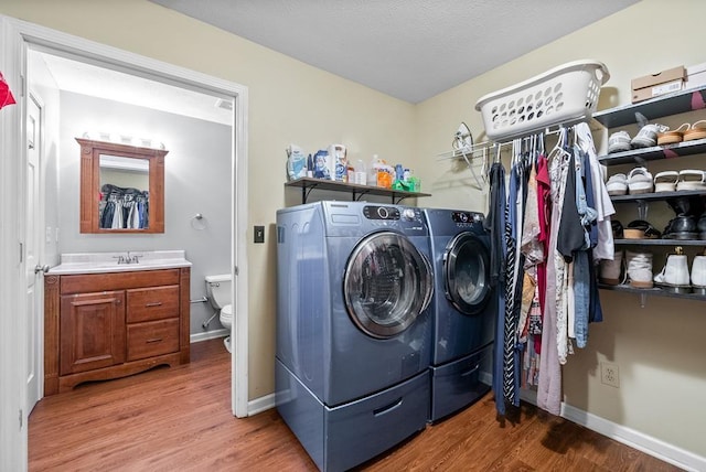 705 Pineridge Dr, Hopkinsville, KY 42240 - laundry area featuring washer and clothes dryer and wood finished floors