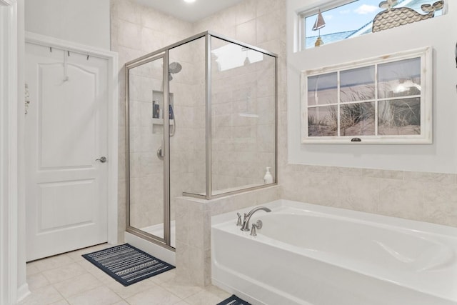 1055 Sumner Grv, Spring Hill, TN 37174 - full bathroom with a bath, a stall shower, and tile patterned flooring