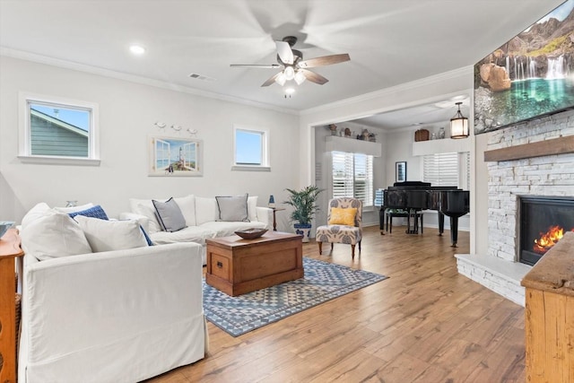 1055 Sumner Grv, Spring Hill, TN 37174 - living room with crown molding, a ceiling fan, light wood-style floors, and a fireplace