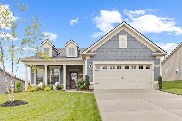 1055 Sumner Grv, Spring Hill, TN 37174 - view of front facade featuring a front lawn, driveway, a garage, and covered porch