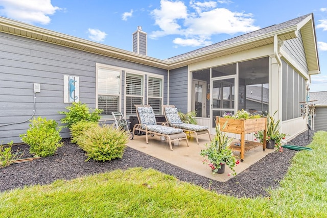 1055 Sumner Grv, Spring Hill, TN 37174 - rear view of property with a patio area, a chimney, and a sunroom