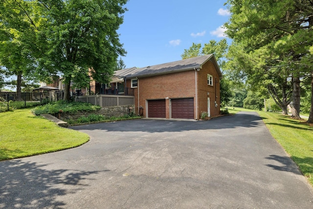 9505 Inavale Ln, Brentwood, TN 37027 - view of home's exterior featuring brick siding, driveway, and a garage