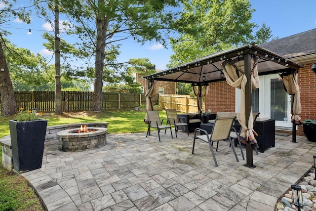 9505 Inavale Ln, Brentwood, TN 37027 - fenced backyard with an outdoor fire pit, a patio, and a gazebo
