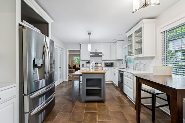 9505 Inavale Ln, Brentwood, TN 37027 - kitchen featuring appliances with stainless steel finishes, wood counters, under cabinet range hood, and white cabinetry