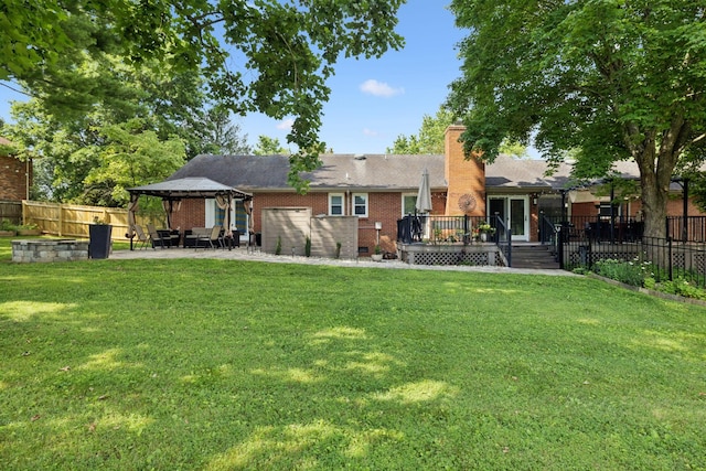 9505 Inavale Ln, Brentwood, TN 37027 - back of property with a gazebo, a wooden deck, a fenced backyard, and a chimney