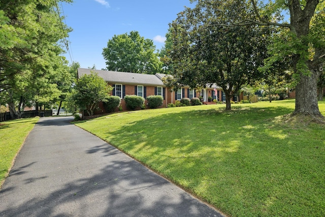 9505 Inavale Ln, Brentwood, TN 37027 - view of front facade with brick siding and a front lawn