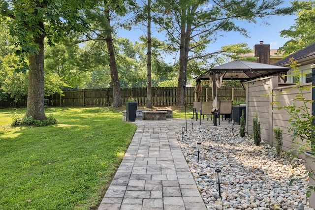 9505 Inavale Ln, Brentwood, TN 37027 - fenced backyard featuring a gazebo, a fire pit, and a patio area