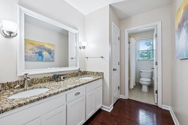 9505 Inavale Ln, Brentwood, TN 37027 - bathroom featuring hardwood / wood-style floors, double vanity, and a shower with shower curtain