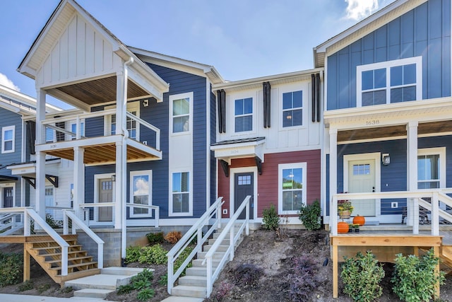 1594 S Watkins St, Chattanooga, TN 37404 - townhome / multi-family property featuring board and batten siding, a porch, a balcony, and stairs