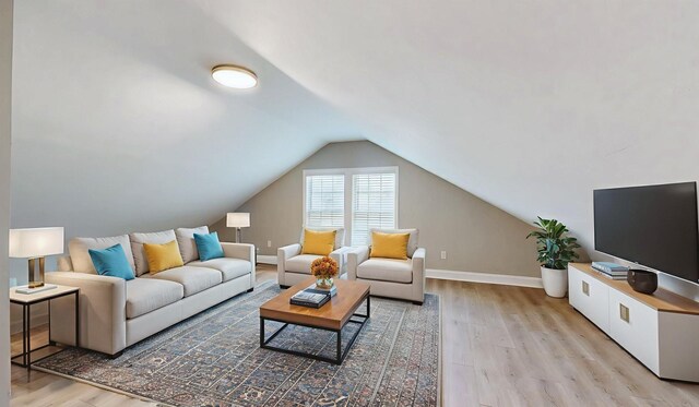7313 Horn Tavern Ct, Fairview, TN 37062 - living area featuring light wood finished floors and vaulted ceiling