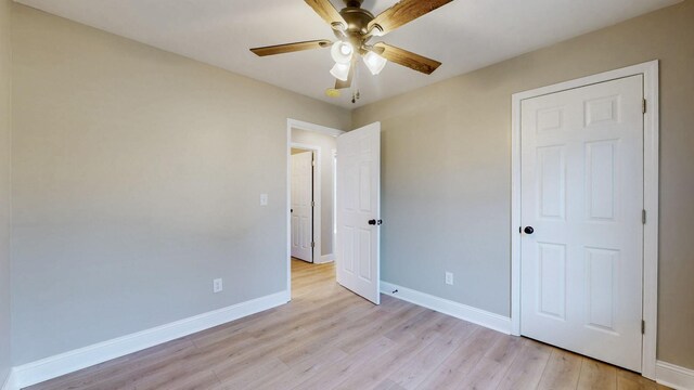 7313 Horn Tavern Ct, Fairview, TN 37062 - unfurnished bedroom featuring light wood finished floors and a ceiling fan