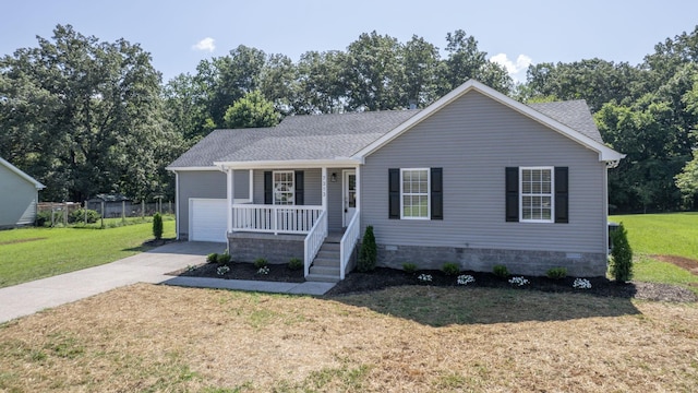7313 Horn Tavern Ct, Fairview, TN 37062 - view of front of property featuring covered porch, a front lawn, driveway, an attached garage, and a shingled roof