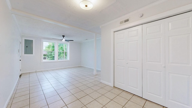2104 W Richmond Hill Dr, Nashville, TN 37207 - unfurnished bedroom featuring electric panel, light tile patterned floors, a closet, ornamental molding, and a textured ceiling