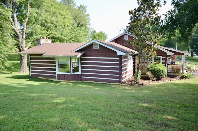 1355 Westfield Rd, Dickson, TN 37055 - rear view of property featuring a chimney and a yard