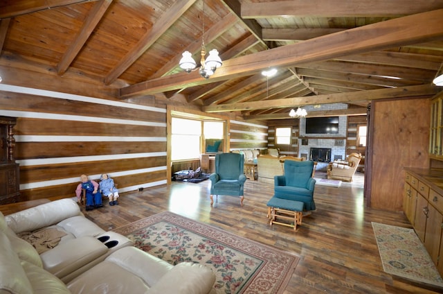 1355 Westfield Rd, Dickson, TN 37055 - living area featuring a chandelier, wooden walls, wood-type flooring, wooden ceiling, and a fireplace